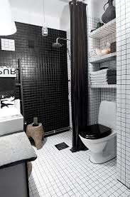 Black and white is a timeless color scheme for any space but many people today say that it's too ordinary we've prepared some cool ideas to go for black and white in the bathroom but still keep it this small black and white space is spruced up with mosaic tiles on the floor and a wooden ceiling. Tiny Black And White Apartment Decorated With Subway Tiles Black White Bathrooms Bathroom Design White Bathroom