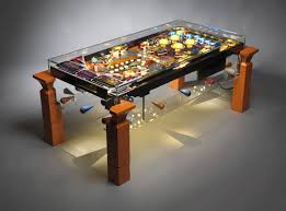 You can easily move this table from one place to other. Druid Interactive Coffee Table Represents Art Of Vintage Pinballs