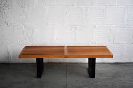 Natural mollusk shells set into a grey wood frame, these tables have depth and dimension as well as a natural organic feel. George Nelson Style Slatted Bench Coffee Table The Good Mod