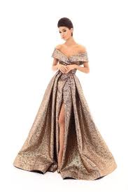 Tarik Ediz 93621 Features An Off The Shoulder Neckline With A Sheath Underskirt This Jacquard Gown Is Desi Classy Evening Gowns Gold Evening Gowns Ball Gowns