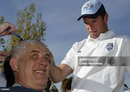 Arthur Birch gets his head shaved by Danny Buderus of the NSW Blues... News  Photo