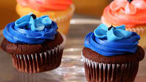 Simple cupcake toppers, made from fondant, for a boy baby shower. Baby Boy Cupcakes Decorating Ideas Online