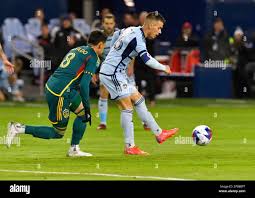 LA Galaxy midfielder Marco Delgado (8) heads the ball over Real Salt Lake  midfielder Diego Luna (26) during the second half of an MLS soccer match in  Carson, Calif., Saturday, Oct. 1,