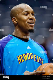New Orleans Hornets' David West, left, tries to hold onto the ball as Los  Angeles Clippers' Quinton Ross, right, reaches for it during the first  quarter of an NBA basketball game on