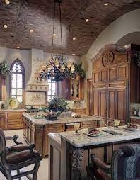 The cushioned wrought iron bar stools, natural stone flooring, glass paneled picture window and pendant lights show great emphasis of a traditional tuscan kitchen design. 9 Simplest Ways To Build Rustic Tuscan Kitchen Design Tuscan Kitchen Design Tuscan Kitchen Country Kitchen Designs