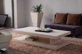 A solid granite dining table creates a pleasing contrast of natural materials on a wood deck. Discover The 10 Uncoming Furniture Trends Pouted Com Coffee Table Stone Coffee Table Faux Marble Coffee Table