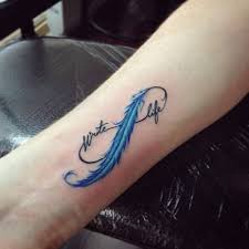 Feather with birds under breast. 90 Feather Tattoo Designs That Will Tickle Your Fancy