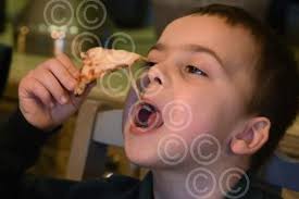 39359605-Caleb, six, enjoys his pizza at the Crown. Picture: DENISE BRADLEY 