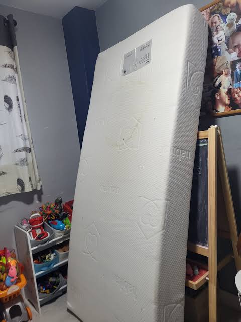  mattress stored in a shed