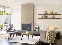 Often, when decorating a modern living room in 2020, designers decide to highlight a wall with a different color fashionable colors in the 2020 living room. Cappuccino Wall Color Living Room Fireplace Paint Ideas Wing Chair In Gray Decoration Cappuccin Brown Living Room Living Room Color Farm House Living Room