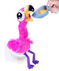 Indulge in your flamingo fanaticism! Gotta Go Flamingo A Singing And Dancing Toy Flamingo That Eats And Poops