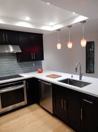 Espresso Cabinets White Quartz Countertops Glass Back Splash White Kitchen Design Kitchen Remodel Kitchen Design Trends
