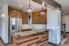 With the red color of the walls and wood color of the cabinets. Expert Advice On Adding A Wet Bar To Your Basement Finished Basements And More