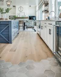 Who Says Rooms Only Need One Type Of Floor Covering We Love The Combination Of A Hexagonal Tile Kitchen Flooring Best Flooring For Kitchen Kitchen Floor Tile