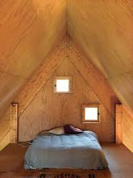 In The Third Floor Bedroom Peekaboo Windows Offer A Glimpse Of The Surrounding Fields A Frame House Rustic Bedroom Bedroom Paint Design