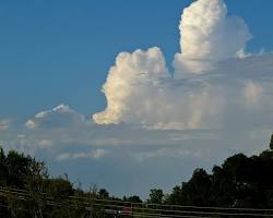 cumulus congestus towering cloud ocean water, AI generated
