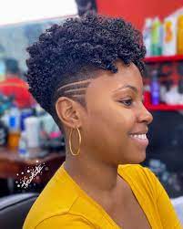 A pixie cut is a short women's haircut with short layers at the back and the sides and a longer section at the top. Natural Hair Pixie Cuts