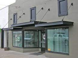 Simple Awning With Steel Channels Metal Awning Painted Brick Exteriors Commercial Property Design