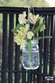 All natural handpicked wood, decorative mason jar with natural rope to secure the jar in place. Outdoor Hanging Flower Mason Jars Setting For Four