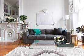 This sofa strikes a streamlined silhouette with a pair of back cushions, track arms, and round tapered legs in the finish. Best Low Sofas Stylish Low Profile Couches For Small Spaces Apartment Therapy