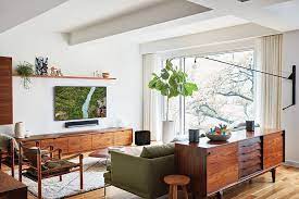 credenza behind the couch with tv and built ins on the wall livingroom layout home studio music room