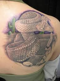 Black snake tattoo on the leg. Pin On Imagines And Tattoos