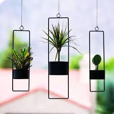 Metallic copper fiberstone oval planter. Matte Black Small Upright Hanging Planter Modern Planter Unique Hanging Planters Metal Planters Hanging Plants