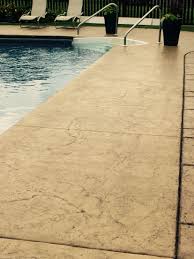 Transform plain, gray concrete with stamped concrete! Stamped And Colored Concrete Pool Deck With Custom Chiseled Stone Cantilevered Coping By Sierra Concrete Arts Outdoor Area Concrete Pool Pool