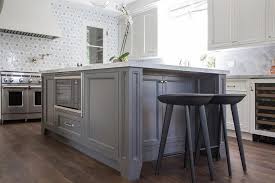 Ivory kitchen cabinets with wood floors. Ivory And Gray Kitchen With Wide Plank Wood Floor Transitional Kitchen