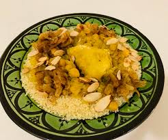 Couscous is a berber dish of small (about 3 millimetres (0.12 in) in diameter) steamed balls of crushed durum wheat semolina that is traditionally served with a stew spooned on top. Moroccan Couscous With Chicken Chickpeas And Raisins Budgetfood