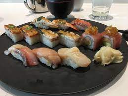 i ate a bunch of aburi sushi flame seared with a couple pieces of rolled sushi and a few pieces of nigiri hamachi toro scallop food best sushi nigiri sushi