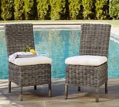 Crafted Of A Durable Synthetic That Replicates The Look And Feel Of Wicker Our Side Chair Wicker Dining Chairs Outdoor Dining Furniture Wicker Dining Armchair