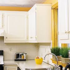 My kitchen cabinets had a natural, grainy wood finish. Pro Secrets For Painting Kitchen Cabinets This Old House