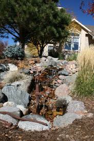 Old Water Pump Incorporated Into The Water Feature Bella Giardino Landscape And Garden Design Colorado Springs Old Water Pumps Water Features Garden Design