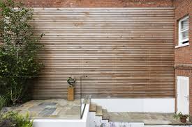 Cedar Hardwood Cladding Of An Exterior Brick Wall Garden Designed By Karen Rogers Krgardendesign Garden Design Small Garden Design Exterior Brick