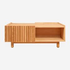 The radius transformable coffee table sits stylishly low to the ground until the user chooses to raise the top to its full height. Coffee Tables Habitat