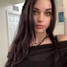 What does the rainbow symbol over a character's head mean in The Sims 4?