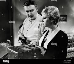 Albert Dekker, Gaby Rodgers, "Kiss Me Deadly" (1955) United Artists File  Reference # 33848-366THA Stock Photo