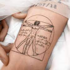 It showcases the quiet majesty of the present, and it emphasizes the mathematical precision and aesthetic merit of the human body. Vitruvian Man Tattoo On The Inner Forearm