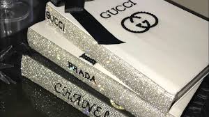 Everybody knows that flowers, books, and probably candles are the best decorations for coffee table. Glammed Up Fashion Designer Coffee Table Books Using Dollar Tree Books G Chanel Book Decor Chanel Decor Glamour Decor
