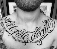 Top 41 Chest Writing Tattoo Ideas 2021 Inspiration Guide Chest Tattoo Quotes Tattoo Quotes Tattoo Designs Men