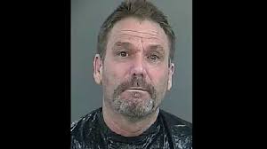 Officials arrest, charge man after driving through building, dragging deputy