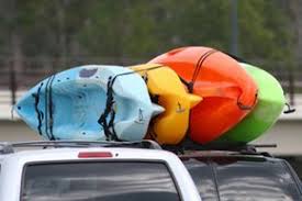 Lift your kayak onto the roof. How To Transport A Kayak Howstuffworks