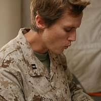 U.S. Marine Corps Sgt. Maj. Todd Parisi renders a salute