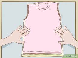 Angkatlah penekan spul sehingga roda berputar, kumparan mengenai ban dan mulailah kumparan terisi benang. 3 Cara Untuk Membuat Baju Menjadi Lebih Kecil Wikihow