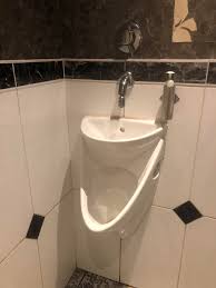 urinal with built in sink. the water