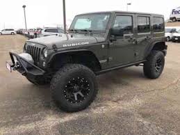 Tank green on black leather with green stitching. Jeep Wrangler 2015 Tank Green Jeep Wrangler Unlimited Used Classic Cars