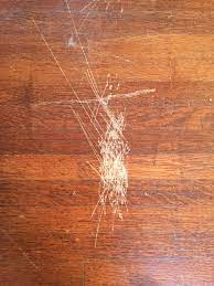 If the scratch or gouge is deep and runs across the grain, you probably won't be able to make it disappear completely, but you should be able to fix it so it's hard to. How Can I Fix These Scratches On Wood Flooring Howto