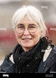 Flensburg, Germany. 22nd Feb, 2022. Andrea Paluch, writer, literary scholar  and translator and the wife of politician Robert Habeck, sits at the museum  harbor of the Flensburg Fjord. Credit: Axel Heimken/dpa/Alamy Live