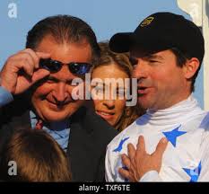 Trainer Rick Dutrow Jr. and jockey Kent Desormeaux (R), for winning horse  Big Brown, celebrate in the winner's circle at the 133rd running of the  Preakness horse race at Pimlico Race Course